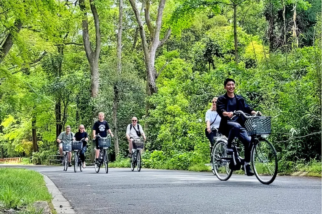 Guests riding e-bikes during the SunnyCycle Kyoto e-bike tour